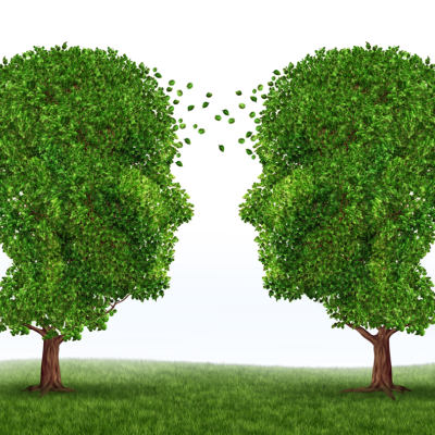 Two trees shaped like human faces in profile face each other. Leavers appear to be blowing and moving between the two.